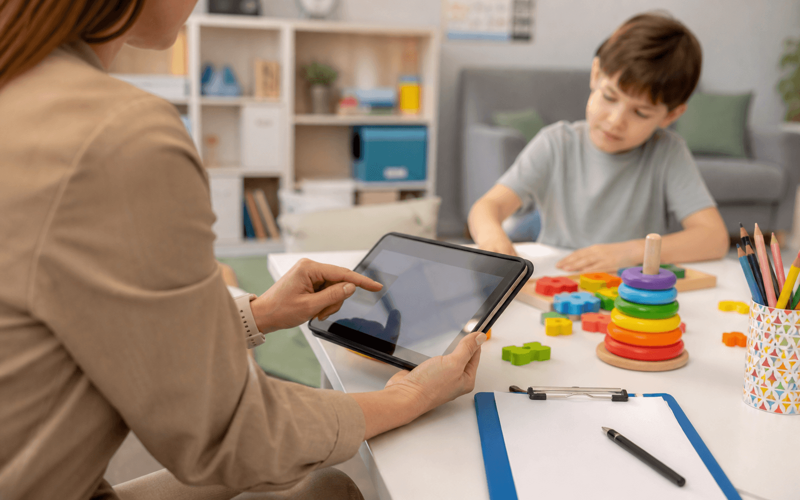 Child using a tablet during a guided activity